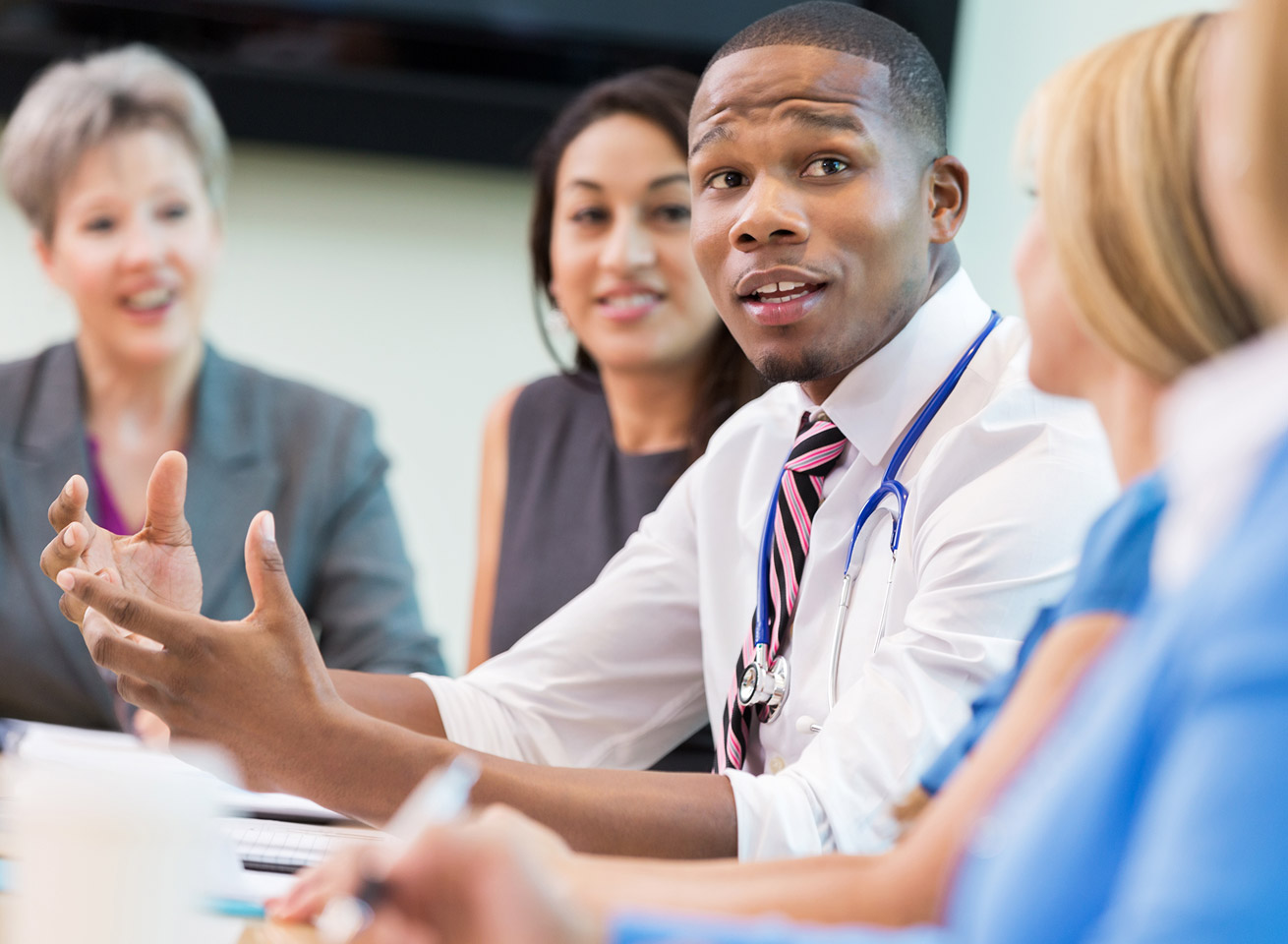 Physician leadership discussing program standardization