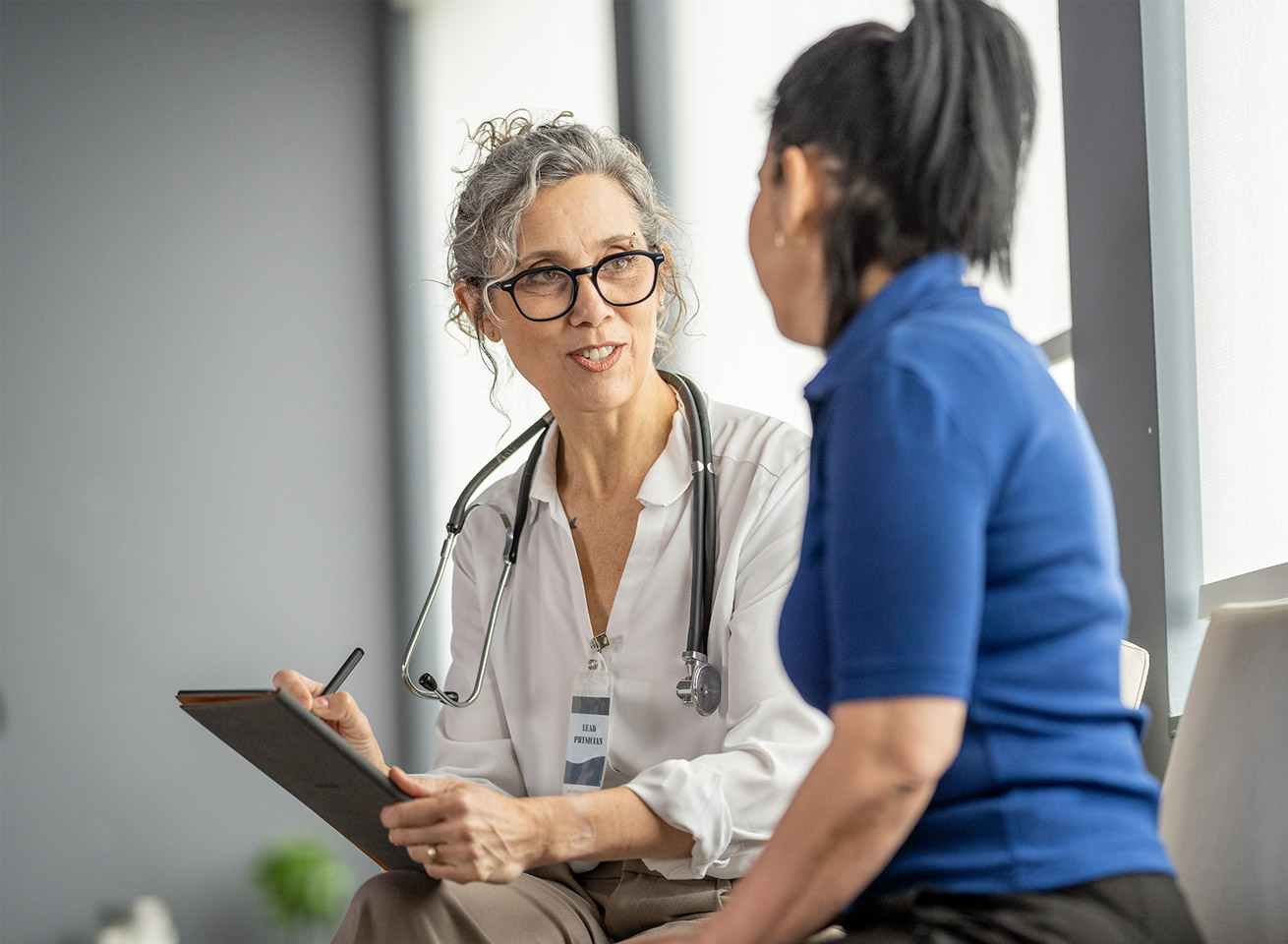 Clinical and operational leadership reviewing enterprise analytics